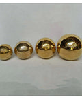 Four solid H62 brass balls of varying sizes displayed on a white background, part of 100-Pack 3.175mm Ceramic Balls Solid H62 Brass Ball.