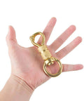 Solid Brass Panic Snap 1-1/8 Inch By 4-1/4 Inch Quick Release With Round Swivel Eye held in hand for size reference