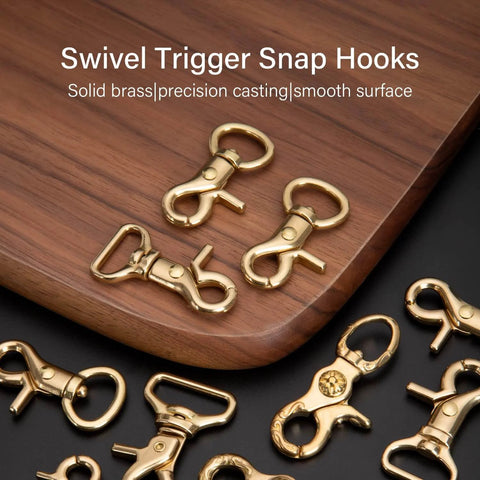 Solid Brass Trigger Snap Hooks Swivel Lobster Clasps For Straps Bags Belting Leathercraft Heavy Duty Clips on wood surface