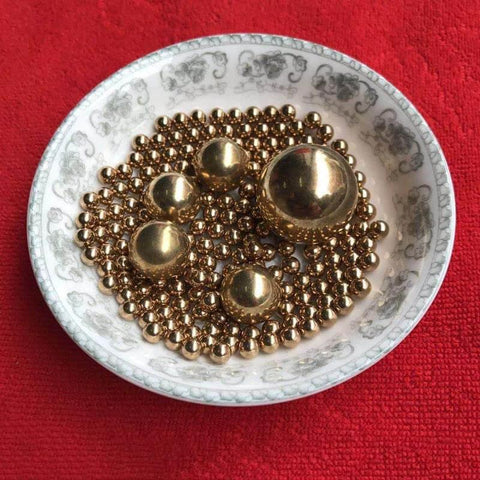 15.8mm 20pcs Solid Pure Copper Balls - Brass Ball Bead displayed in a decorative dish