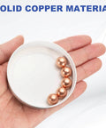 Solid Copper Bearing Balls 12mm Diameter Set Of 5 With G200 Precision For Machinery Automotive And DIY Projects Made From Corrosion Resistant T2 Copper By uxcell in a hand