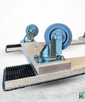 Close-up of American Made Solid Oak H Frame Furniture Dolly with 3.5 inch thermo rubber wheels by CasterHQ.