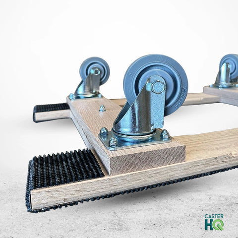 Close-up of American Made Solid Oak H Frame Furniture Dolly with 3.5 inch thermo rubber wheels by CasterHQ.