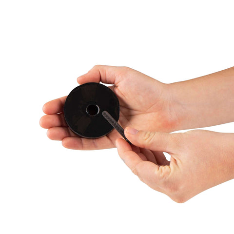 Hands holding Anti Vibration Leveling Mount Kit With Sorbothane Shock Absorption 70 Duro For Superior Dampening One Quarter Twenty Mounting Stud