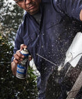Man using Heavy Duty Lubricating Oil For Tools And Machinery 11 Oz Keeps Moving Parts Slick Quiet And Rust Free Perfect For Hinges Chains Sprockets Locks And Small Engines A Trusted Workhorse From Liquid Wrench on garden tool.