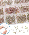 Close-up view of 330Pcs Nine Size Spring Hose Clamps Set 5mm To 13mm in a plastic organizer, showing 65Mn galvanized spring clips.