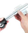 Close-up of hands holding Spring Loaded Gate Caster Set Of Two With Two And A Half Inch PU Swivel Wheels Four Hole Mounting Plate