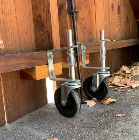 Gate Caster Wheel For 4 Inch And 5 Inch Heavy Duty Spring Loaded Gate Caster With Adjustable Bracket Universal Mount Plate Rubber Wheel 250 To 500 Lbs Load Capacity Suitable For Wooden Gates And Fences Two Pack Or Single Unit installed on wooden gate
