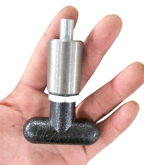 T knob Spring Loaded Pop Pin, zinc plated steel plunger with black plastic T-handle knob, held in hand for size reference.