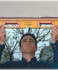 Man using Stabila 37816 48 Inch And 16 Inch Aluminum Box Beam Level Set with German accuracy for framing in construction project