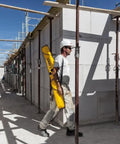 Worker carrying Stabila Jamber Level Case provides secure single-carry transport and organized storage for six level sizes on site.