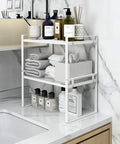 Two Pack Steel Frame Stackable Cabinet Shelf Organizer Racks in bathroom with towels and toiletries, white finish.
