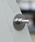 Close-up of a stainless fender washer 1/4 inch inner, 1 inch outer diameter, installed on metal surface with bolt, pack of 100.