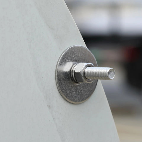 Close-up of a stainless fender washer 1/4 inch inner, 1 inch outer diameter, installed on metal surface with bolt, pack of 100.