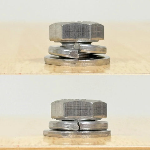 Front view of a 1/4-inch stainless steel hex nut atop flat washer and split lock washers