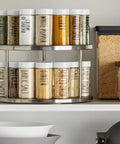2-Tier Lazy Susan Spice Rack Organizer for Cabinet and Pantry, Stainless Steel, 10.5 Inch Diameter, filled with spice jars