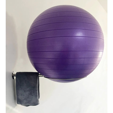 Wall Mounted Stainless Steel Exercise Ball Holder with purple yoga ball and towel, fits 13 to 34 inch balls, includes mounting hardware