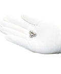 Gloved hand holding three Stainless Steel Bearing Balls One Quarter Inch Pack Of 100 For Bicycles Motorcycles And Auto Parts 304 Grade