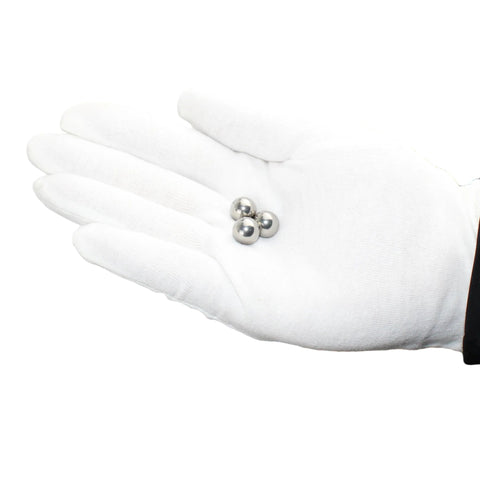 Gloved hand holding three Stainless Steel Bearing Balls One Quarter Inch Pack Of 100 For Bicycles Motorcycles And Auto Parts 304 Grade