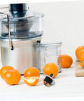 Replacement Coupling Pin for Juicer and Blender Parts With Stainless Steel Construction next to juicer and oranges