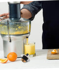 Replacement Coupling Pin for Juicer and Blender Parts With Stainless Steel Construction No Fuss Plug And Play Easy Install And Secure Connection For Smoothies And Food Processing Applications Kitchen Accessory Built To Last next to a juicer in use