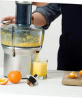 Stainless Steel Blender And Juicer Coupling Replacement Part With Plug And Play Easy Install And Secure Connection shown with juicer