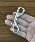 Hand holding 3.5 Inch Double Ended Bolt Snap Hook, Stainless Steel Marine Grade 316, for Diving and Boating Use