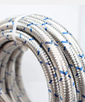 Close-up of Three Eighth Inch Stainless Steel Braided Fuel Line Hose E85 Compatible Kit with 30 Feet Length, highlighting braided detail.