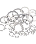 Variety of stainless steel C-clips from the 265 Piece Metric Stainless Steel C Clips External Retaining Ring Assortment Kit by HVAZI.