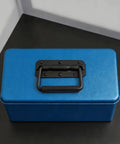 Spring Loaded Chest Handle Set Of 2 With Rubber Grip on a blue storage box, rust-resistant stainless steel with a black finish.