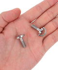 Hand holding two stainless steel camera screws, Two Pack One Quarter Twenty Thread D Ring Stainless Steel Camera Fixing Screws For Tripod Mounts and Quick Release Plates