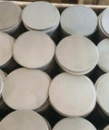 Stack of two inch diameter quarter inch thick 304 stainless steel round disc plates USA made with precision CNC plasma cut for clean edges.