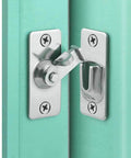 MINI Size 90 Degree Door Latch installed on turquoise door, stainless steel, for sliding and pocket doors, secure hasp latch clasp lock