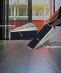 Built Tough Door Stop Wedge With Adjustable 0.5 To 3 Inch Gap Anti Slip Base And Silencer Pad Floor Scratch Guard Noise Reduction For Heavy Doors At Home And Office, shown side view with silicone wave texture on wood floor.