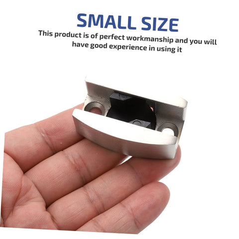 Stainless steel bathroom door stopper silences drafts, reduces noise, and keeps doors secure held in hand, showing small size.
