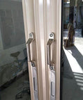 Heavy Duty 304 Stainless Steel Drawer Cabinet Pull Handle 100mm Center Hole For Cabinets And Drawers installed on a glass door