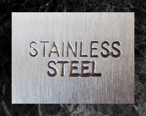 Close-up of the text 'Stainless Steel' engraved on a metal surface for Three Sixteenth Inch 440 Stainless Steel Bearing Balls Grade G25.