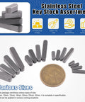 Stainless steel key stock assortment with various sizes displayed next to a coin. Feather Key Stock Set 140Pcs in 16 Sizes.