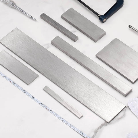 Stainless Steel Flat Bar Quarter Inch Thick By Two Inch Wide Twelve Inch Long With Heavy Duty Brushed Finish Trim Strip For Kitchen Diy Crafts 304 Grade Silver Tone uxcell displayed with tools.