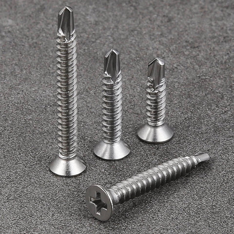 500pcs #8 x 5/8 Inch Flat Head Self Tapping Sheet Metal Screws in stainless steel with deep threads, displayed on gray surface