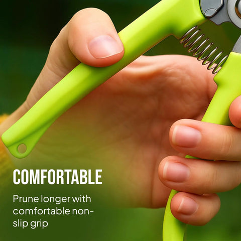 Close-up of a hand gripping the green handle of a pruning shear from the 2 Pack Stainless Steel Gardening Scissors Set With Pruning Shears And Clippers For Garden Pruning Versatile Dual Cut Pruning Combo For Delicate Flower And Shrub Trim To Thick Branches Vegetables Fruits And Landscaping.