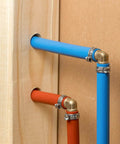 Close-up of Fifty Pieces Stainless Steel 304 Single Ear Hose Clamps For Hoses From 10.8 To 13.3 Mm installed on blue and red pipes.