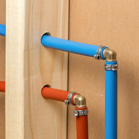 Close-up of Fifty Pieces Stainless Steel 304 Single Ear Hose Clamps For Hoses From 10.8 To 13.3 Mm installed on blue and red pipes.
