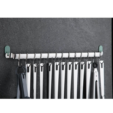 Kitchen Utensil Rail Organizer - Wall Mounted Gourmet Rack with 14 Hooks showing hanging utensils against a dark wall