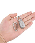 Hand holding 6Pcs 304 Stainless Steel M15 Single Pulley Block, Wire Rope Hanging Wire Towing Wheel, with 6Pcs Spring Snap Hook heavy duty