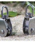 Two Stainless Steel Pulley M15 Single Wheel Swivel Lifting Rope Pulley Set Lifting Wheel Tools on sandy surface