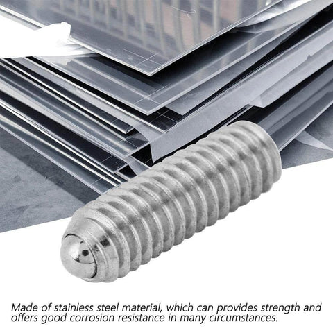 Stainless steel M4 x 12mm hex spring ball plunger screw close-up on metal sheets, highlighting smooth ball action for precision positioning