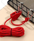 Stainless Steel Nylon Adjustable Rope Fastener With Fixed Buckle And Pulley For Awning Wind Ropes And Tent Ropes in red, coiled view