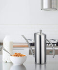 Premium Stainless Steel Olive Oil Dispenser For Precision Pouring And Pro Grade Kitchen Style Leakproof Cruet With Ergonomic One Piece Body Long Narrow Spout And Arc Handle 24 Ounce 700 Milliliters SUS304 18 10 Construction By KSENDALO in kitchen setting
