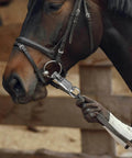 Close-up of U Type Quick Release Clip With Rotatable Eye Stainless Steel Panic Snap attached to horse bridle, used for lead ropes and tie-offs.